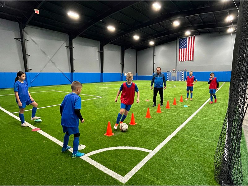 Kids soccer practice on the indoor turf field at CJ Lasso Arena