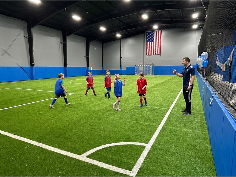 Young players during a coached match at CJ Lasso Sports Arena